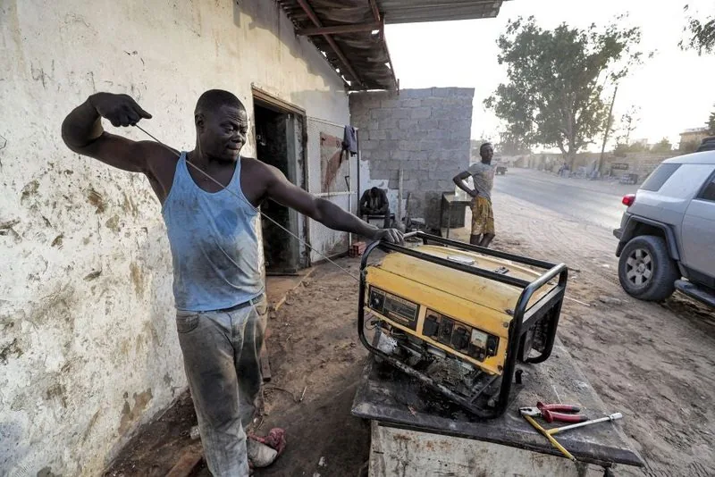 Generator technician servicing a generator set in Eket, Akwa Ibom