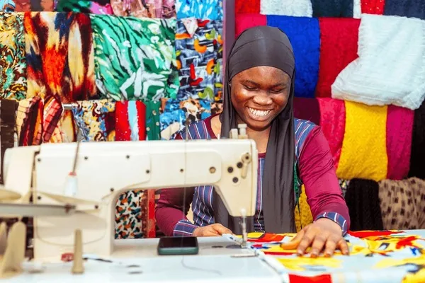 Skilled tailor sewing Ankara fabric in Eket, Akwa Ibom
